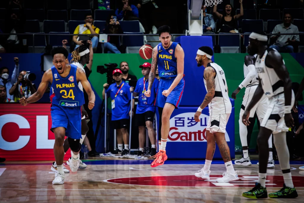 2023-FIBA-World-Cup-Philippines-vs-South-Sudan-Kai-Sotto-x-AJ-Edu | GGSLOT | Sports & Games News Kai Sotto and AJ Edu defending the rim during a FIBA World Cup Asian Qualifiers practice session.