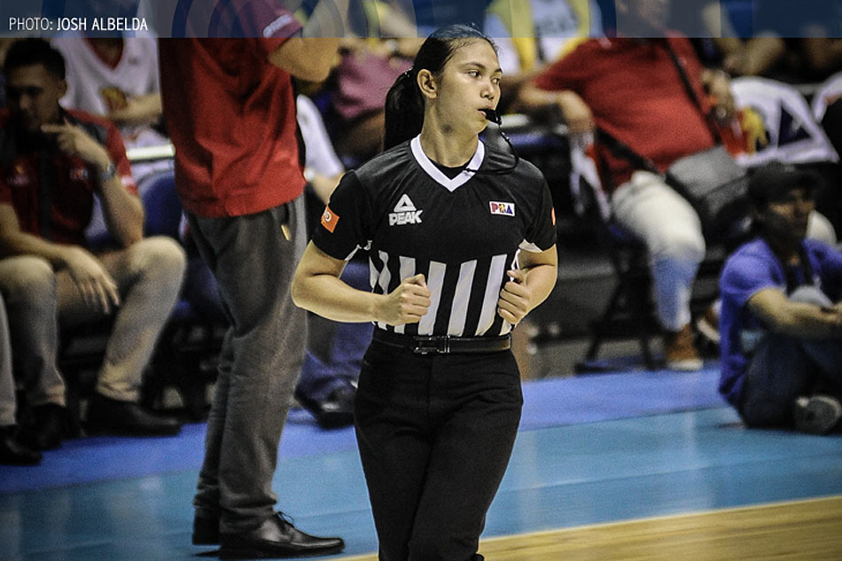 Filipino Street Ball during a local Barangay Liga | GGSLOT | Sports & Games News A referee officiating an intense game of Filipino Street Ball during a local Barangay Liga tournament.