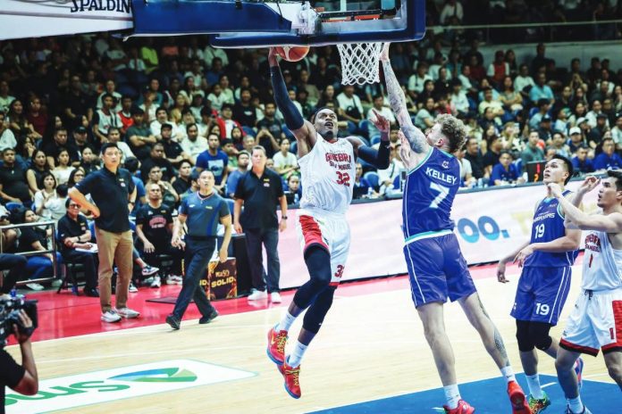 Justin Brownlee and Kylor Kelley competing | GGSLOT | Sports & Games News Alt Text: Justin Brownlee and Kylor Kelley competing during a high-stakes PBA Commissioner’s Cup game.