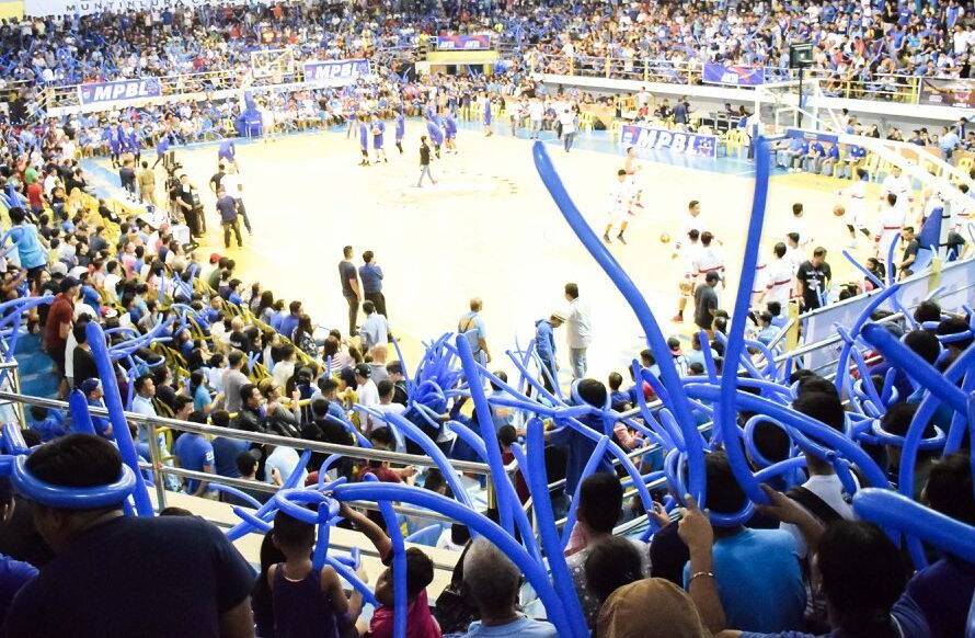 Fans cheering for their local team highlighting MPBL provincial basketball.