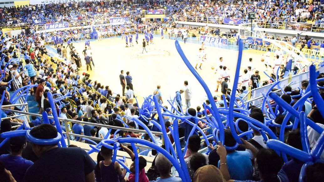 Fans cheering for their local team highlighting MPBL provincial basketball.