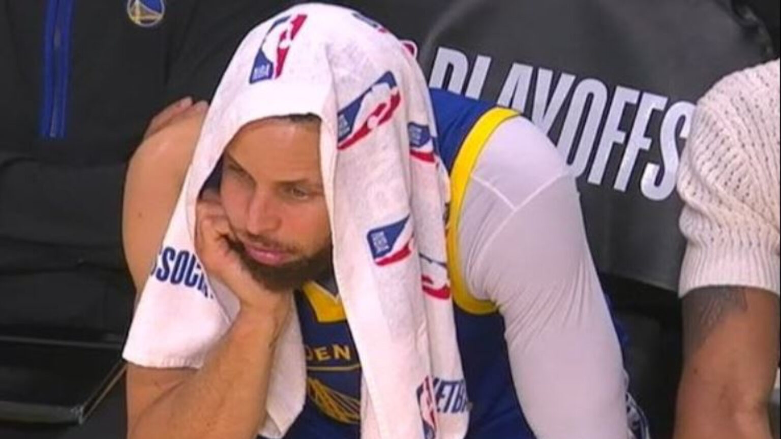 Stephen Curry Warriors Play-In Struggles | GGSLOT | Sports & Games News A frustrated Stephen Curry sitting on the bench during a late-season Golden State Warriors loss.