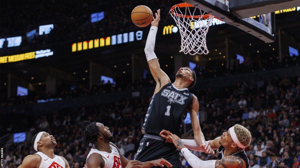 Victor Wembanyama Defensive Dominance | GGSLOT | Sports & Games News Victor Wembanyama using his massive wingspan to block a shot during a San Antonio Spurs game in the 2025-26 season.