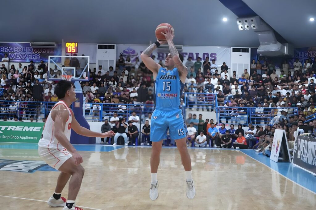 abra-weavers-vs-quezon-huskers | GGSLOT | Sports & Games News Abra Weavers and Quezon Huskers players battling intensely during the 2026 MPBL Pre-Season Invitational Finals.