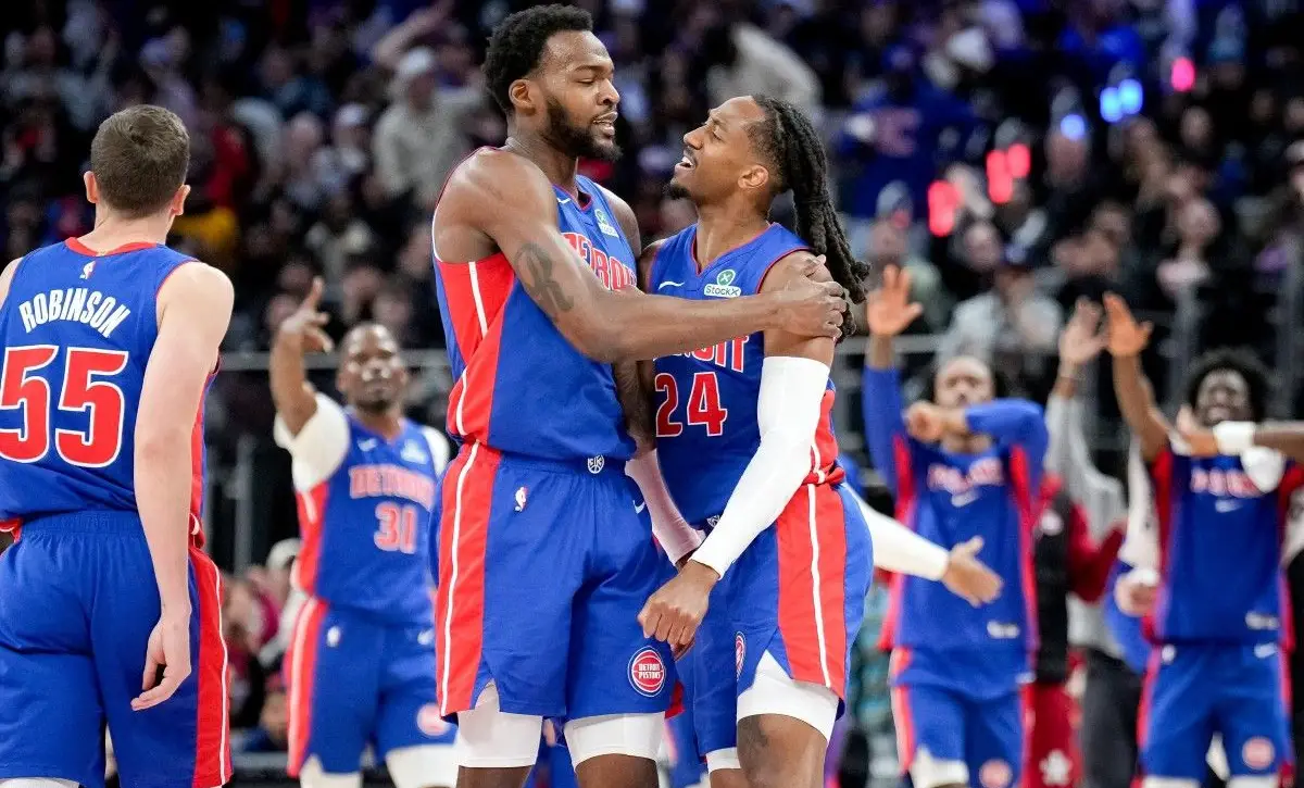 Detroit Pistons players celebrating a defensive stop during the 2026 regular season.