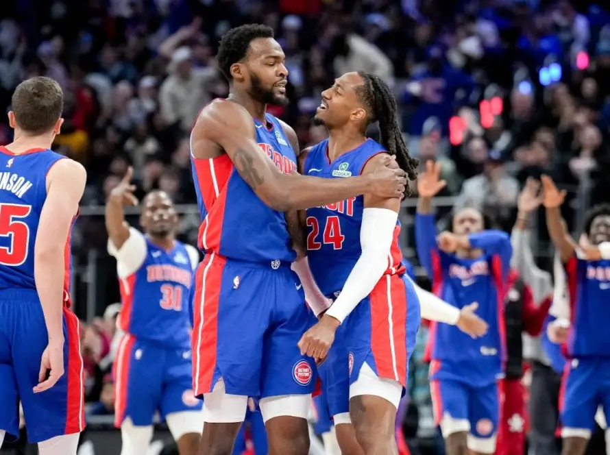 Detroit Pistons players celebrating a defensive stop during the 2026 regular season.