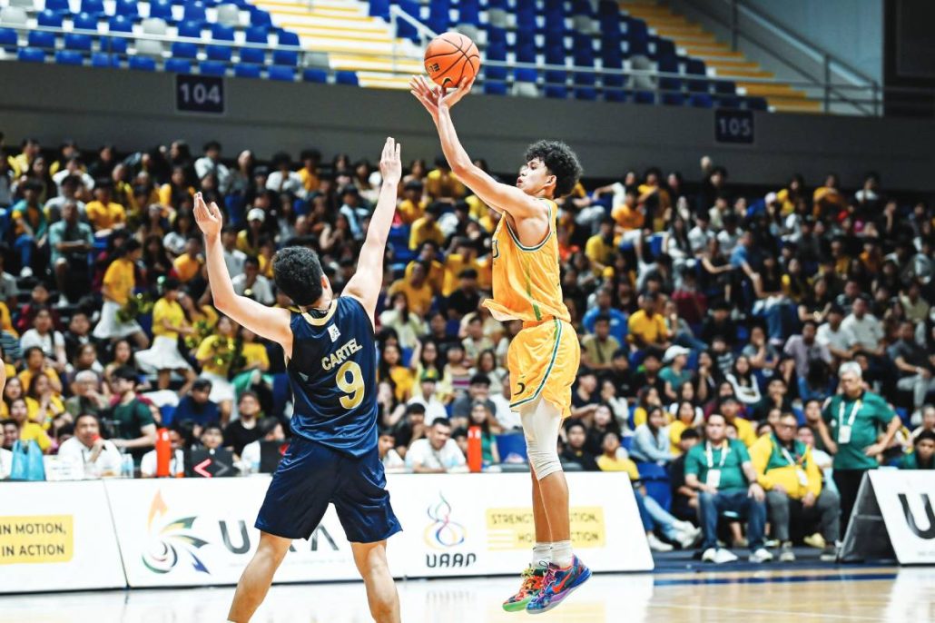feu-d-baby-tamaraws-star-player-action | GGSLOT | Sports & Games News A standout FEU-D Baby Tamaraws basketball player in action during a UAAP juniors division game