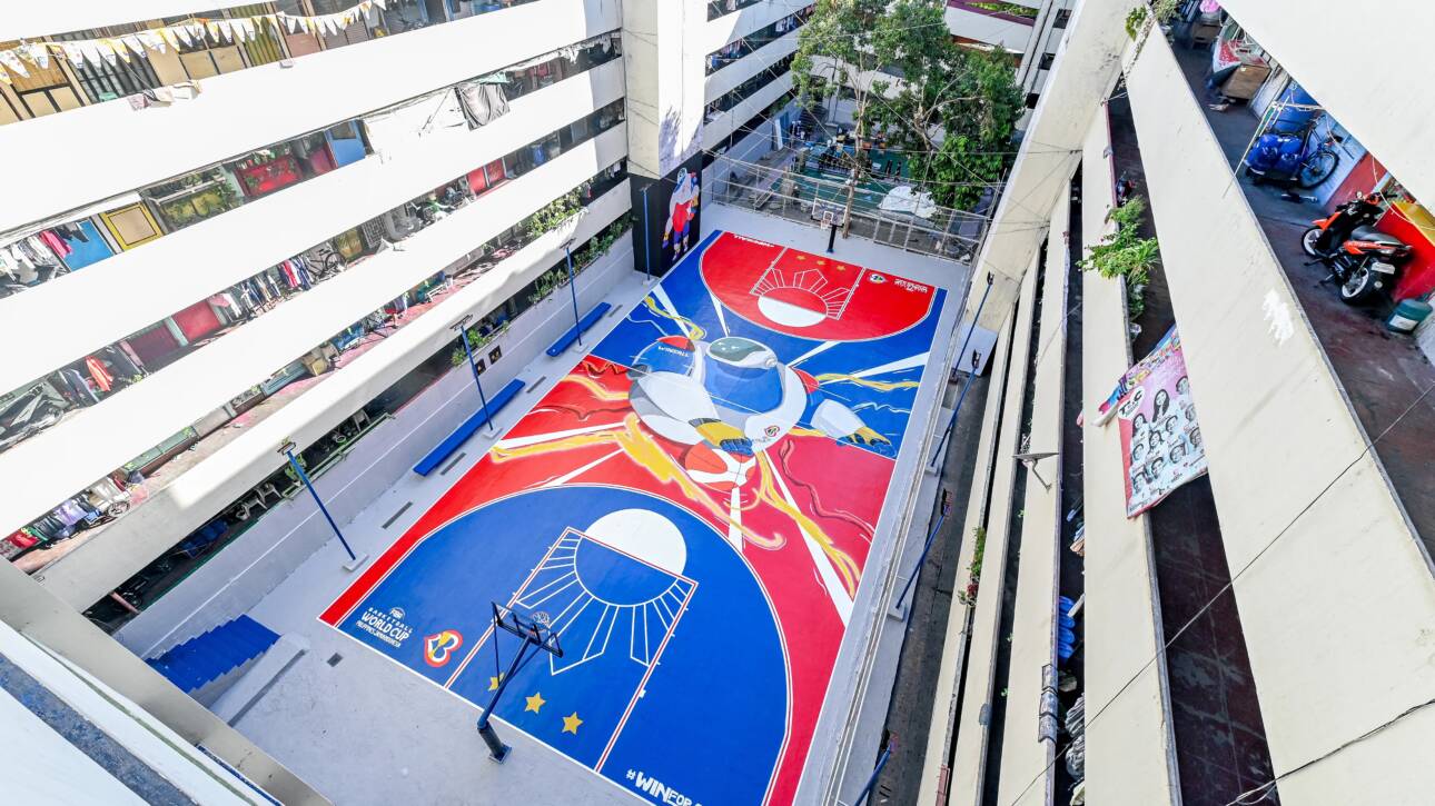 The Taguig Tenement residential building in Metro Manila features a colorful, hand-painted basketball court that highlights the streetball culture of the area.