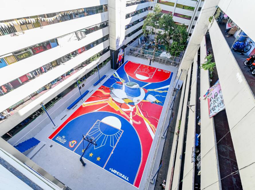 The Taguig Tenement residential building in Metro Manila features a colorful, hand-painted basketball court that highlights the streetball culture of the area.