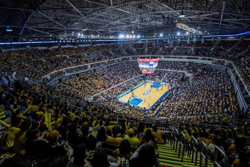 uaap-basketball-game-crowd-philippines-arena | GGSLOT | Sports & Games News A wide shot of a passionate crowd inside a Philippines arena during a high-stakes UAAP basketball game