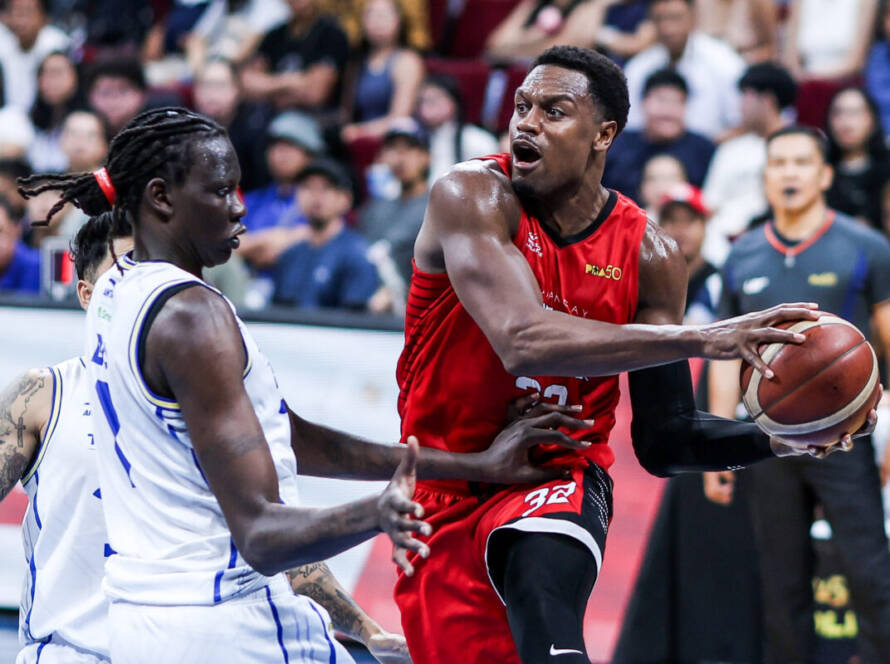 Barangay Ginebra and Phoenix Fuel Masters players battling for position in a PBA Quarterfinals game