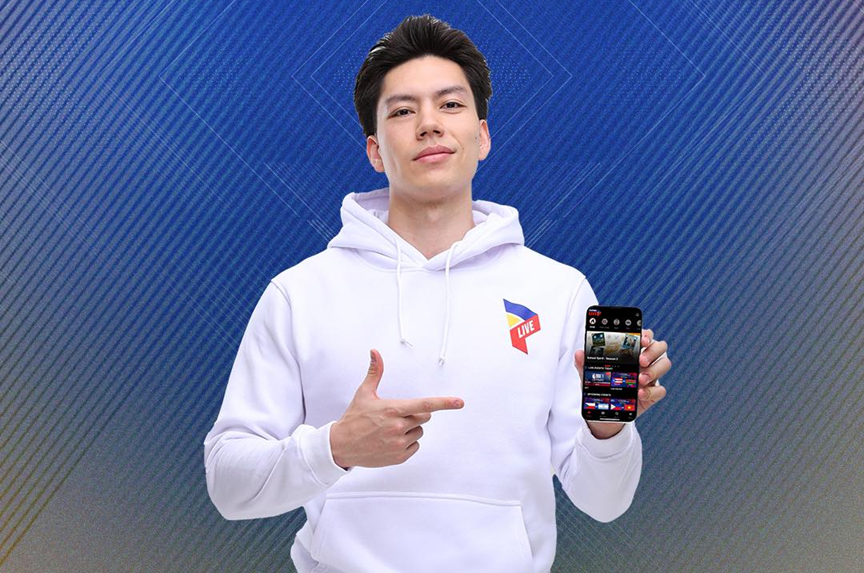 A fan using the Pilipinas Live PBA app on a smartphone to watch a Commissioner's Cup game.