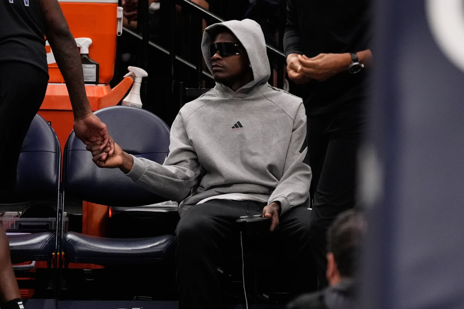 Anthony Edwards watching from the bench in street clothes