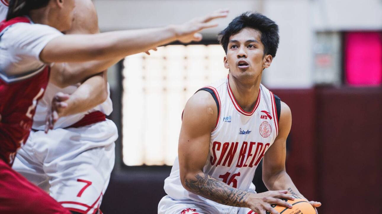 san beda red lions guard daniel marcelo drives past a defender