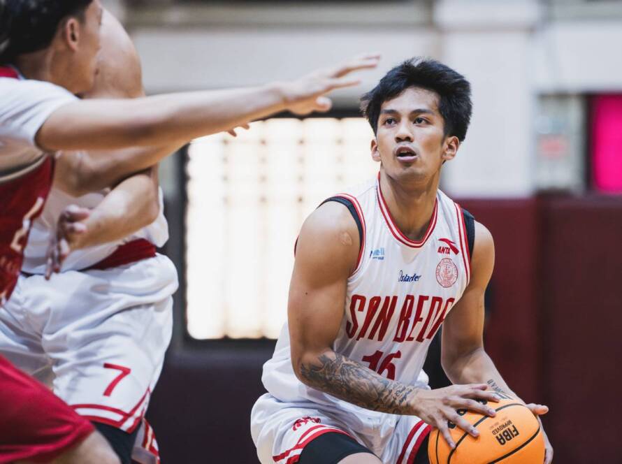 san beda red lions guard daniel marcelo drives past a defender