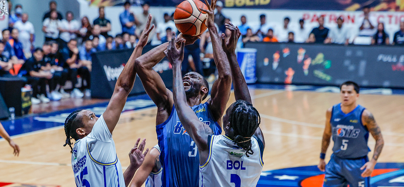 Action shot of a basketball player attacking the rim, showcasing skills during a high-stakes PBA draft combine game.