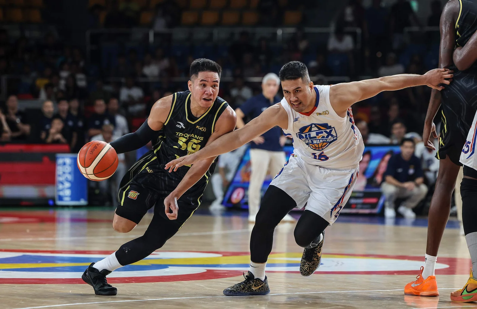 PBA basketball players battling for possession during a high-stakes playoff quarterfinal matchup.