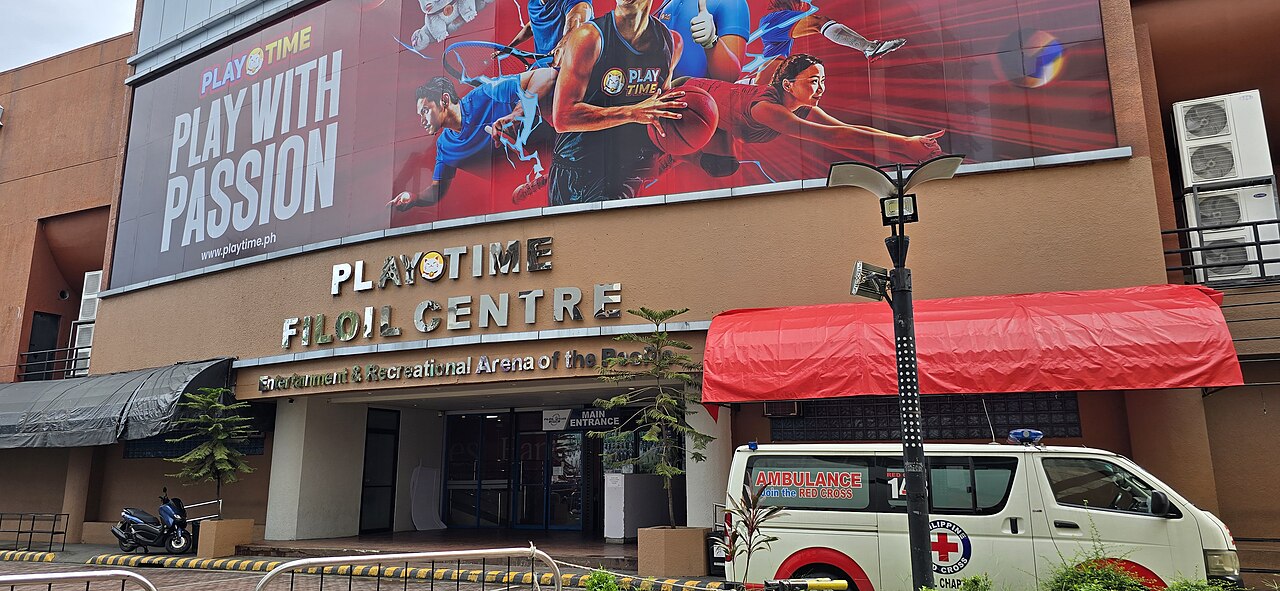 Fans entering the Playtime Filoil Centre ticket booth area in San Juan before a basketball game.