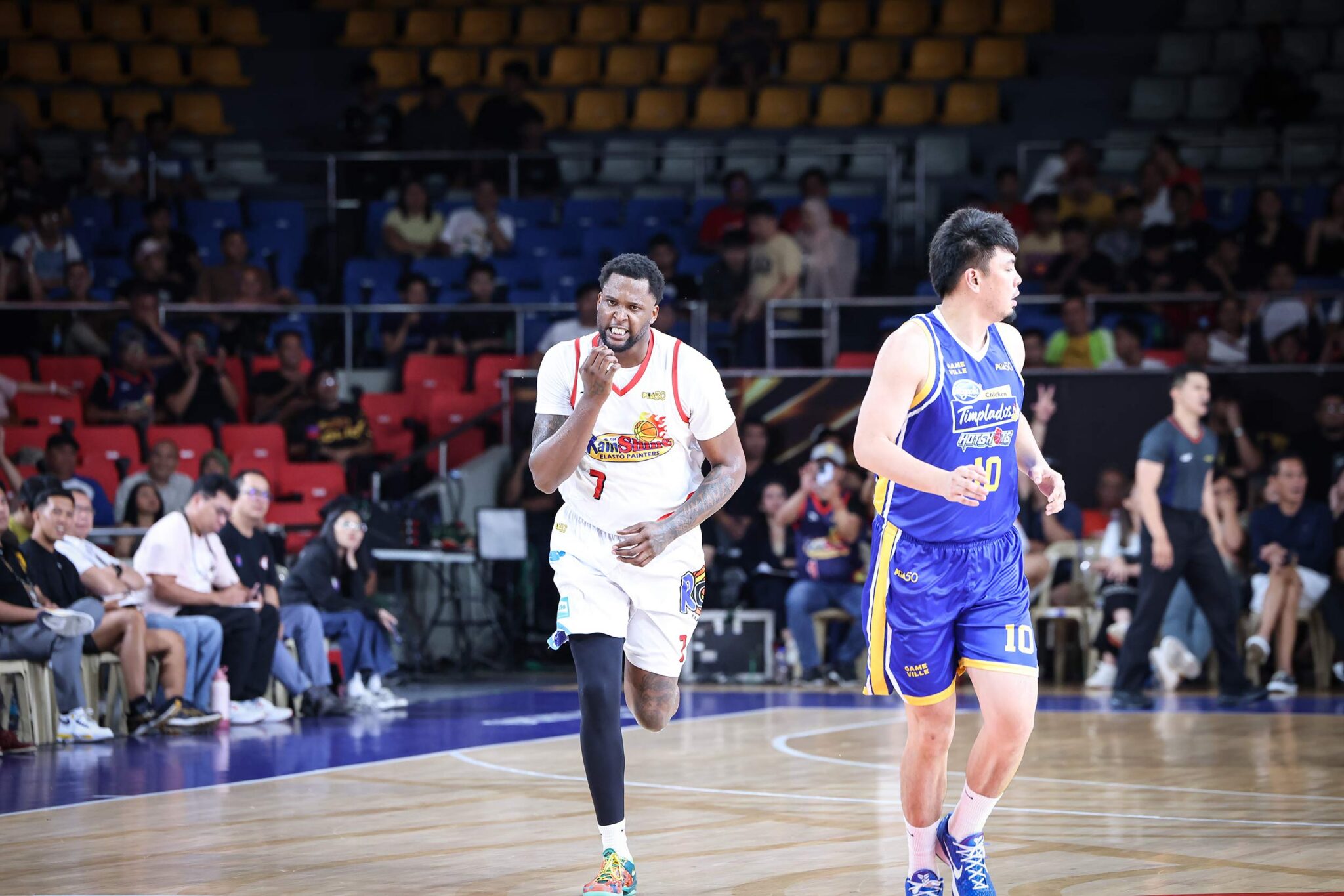 Rain or Shine Elasto Painters players celebrating a basket after their win over Magnolia