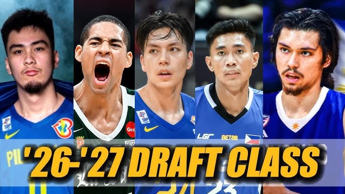 PBA 2026-2027 Draft Class | GGSLOT | Sports & Games News Five young male Philippine basketball players wearing blue jerseys are featured in a row, each displaying different expressions ranging from serious to animated. The promotional banner displays "PIL'26-'27 DRAFT CLASS" in large yellow lettering at the bottom, indicating this is the Philippine Basketball Association's 2026-2027 draft class of prospects.