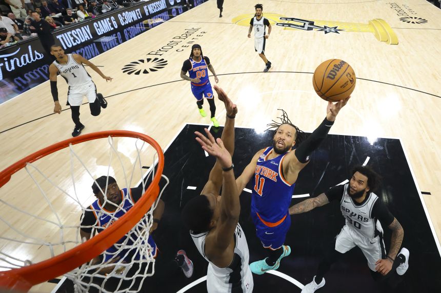 Basketball court action showcasing elite performances like jalen brunson stats.