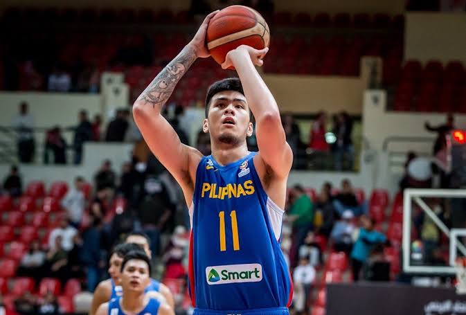 7-foot-3 Filipino center Kai Sotto playing intensely during an international basketball game, symbolizing the global rise of local hoops talent.