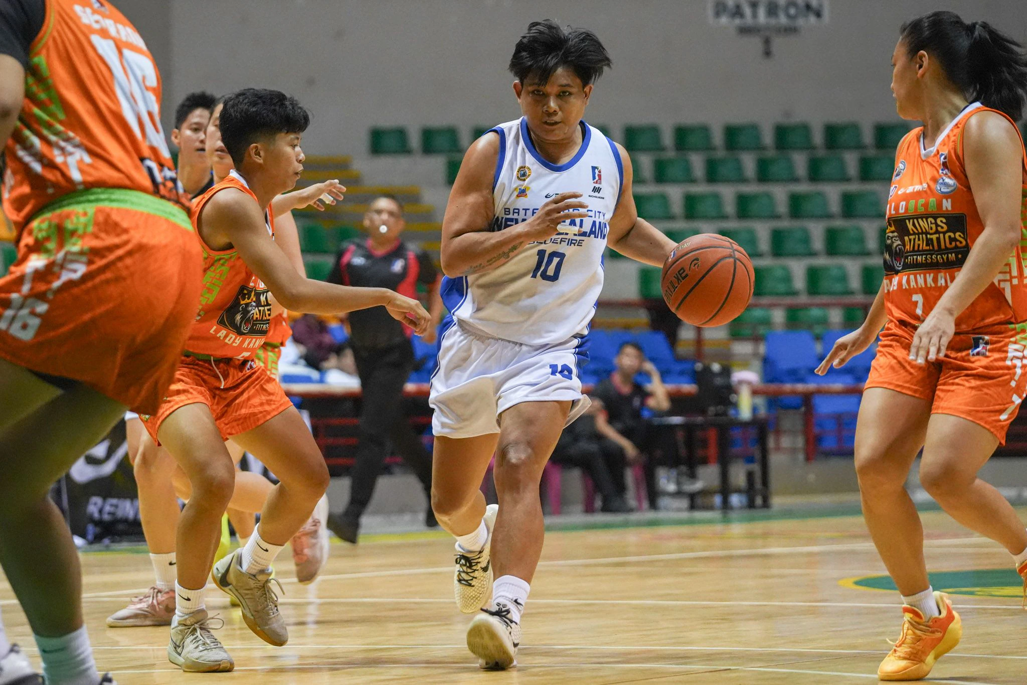 mpbl-schedule-today-official-game-graphic | GGSLOT | Sports & Games News An official game day schedule graphic or action shot from a Maharlika Pilipinas Basketball League match, showing Filipino basketball players competing on a crowded local court.