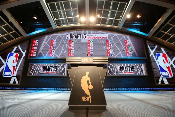 The empty main stage and podium at the Barclays Center set up with team caps for the annual NBA Draft selections