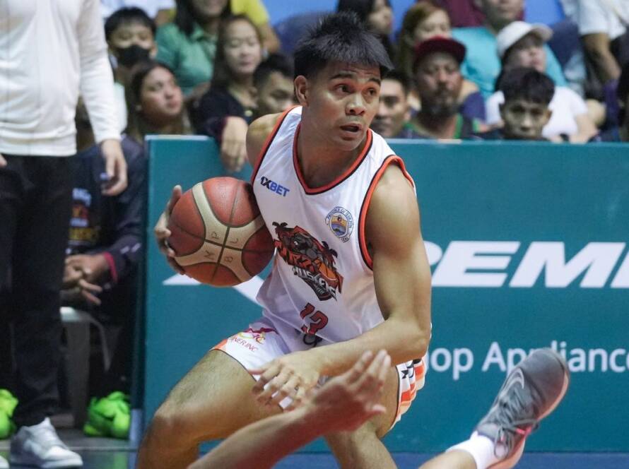 Members of the Quezon Huskers roster executing a defensive stop during a regular season game.