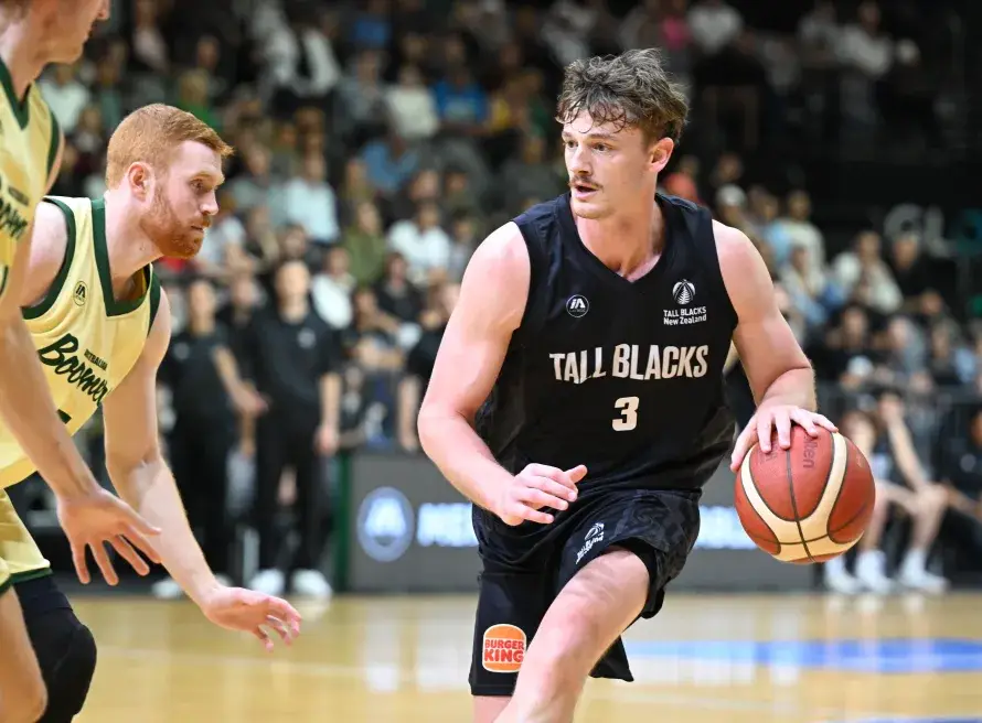 New Zealand basketball team running an offensive play in the half-court.