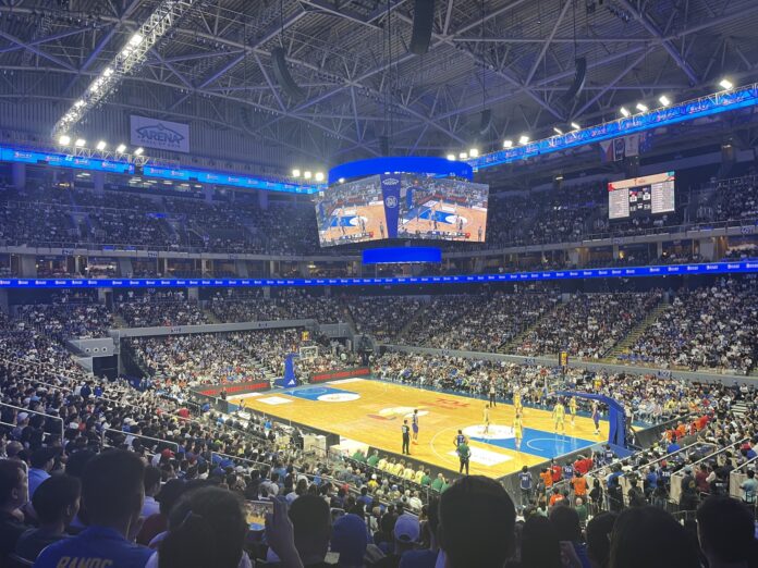 SM Mall of Asia Arena Ready for NCAA Action | GGSLOT | Sports & Games News The bustling SM Mall of Asia Arena filled with fans during a major collegiate basketball Philippines championship game.