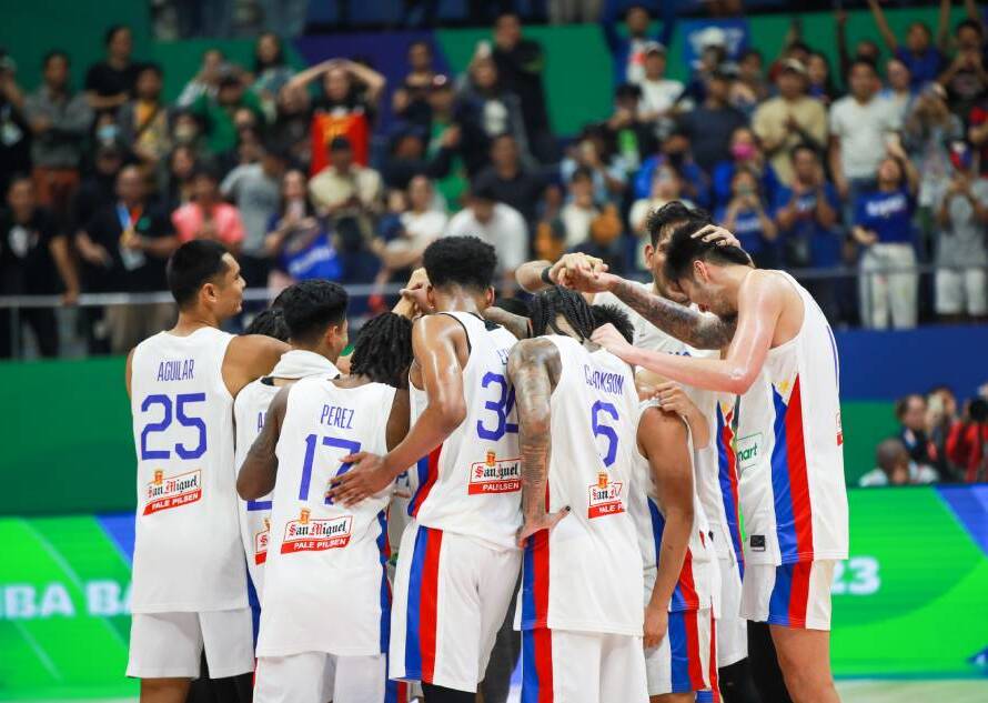 Gilas Pilipinas players huddle during the FIBA Asian Qualifiers.