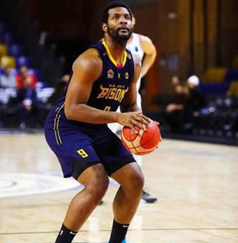 justin-strings-terrafirma-jump-shot | GGSLOT | Sports & Games News Justin Strings elevating for a mid-range jump shot during a highly competitive international pro basketball league game.