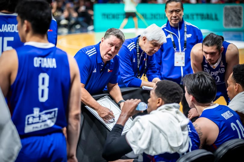 tim-cone-timeout-perth | GGSLOT | Sports & Games News Head Coach Tim Cone discussing tactical adjustments with his players during a timeout.