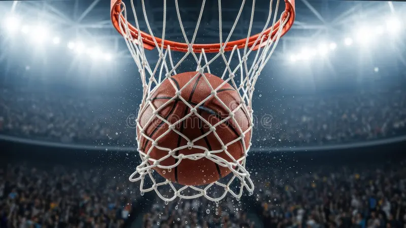 uaap-season-89-crucial-basket | GGSLOT | Sports & Games News A basketball swishes through the net, symbolizing a crucial score in a UAAP 2026 basketball game.